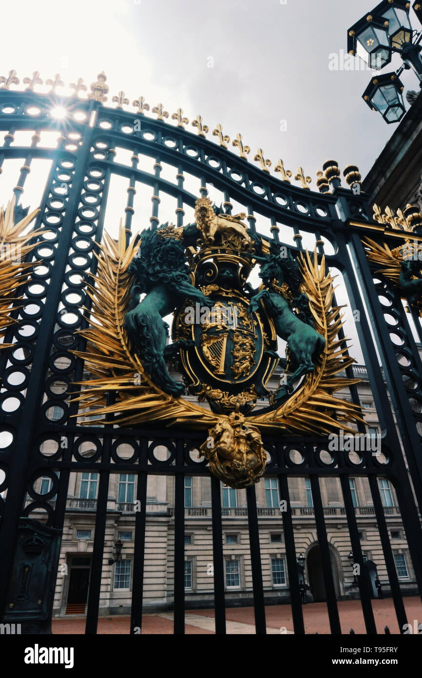 The black gate with impressive golden and black ornament in front of Buckingham Palace, London, UK Stock Photo