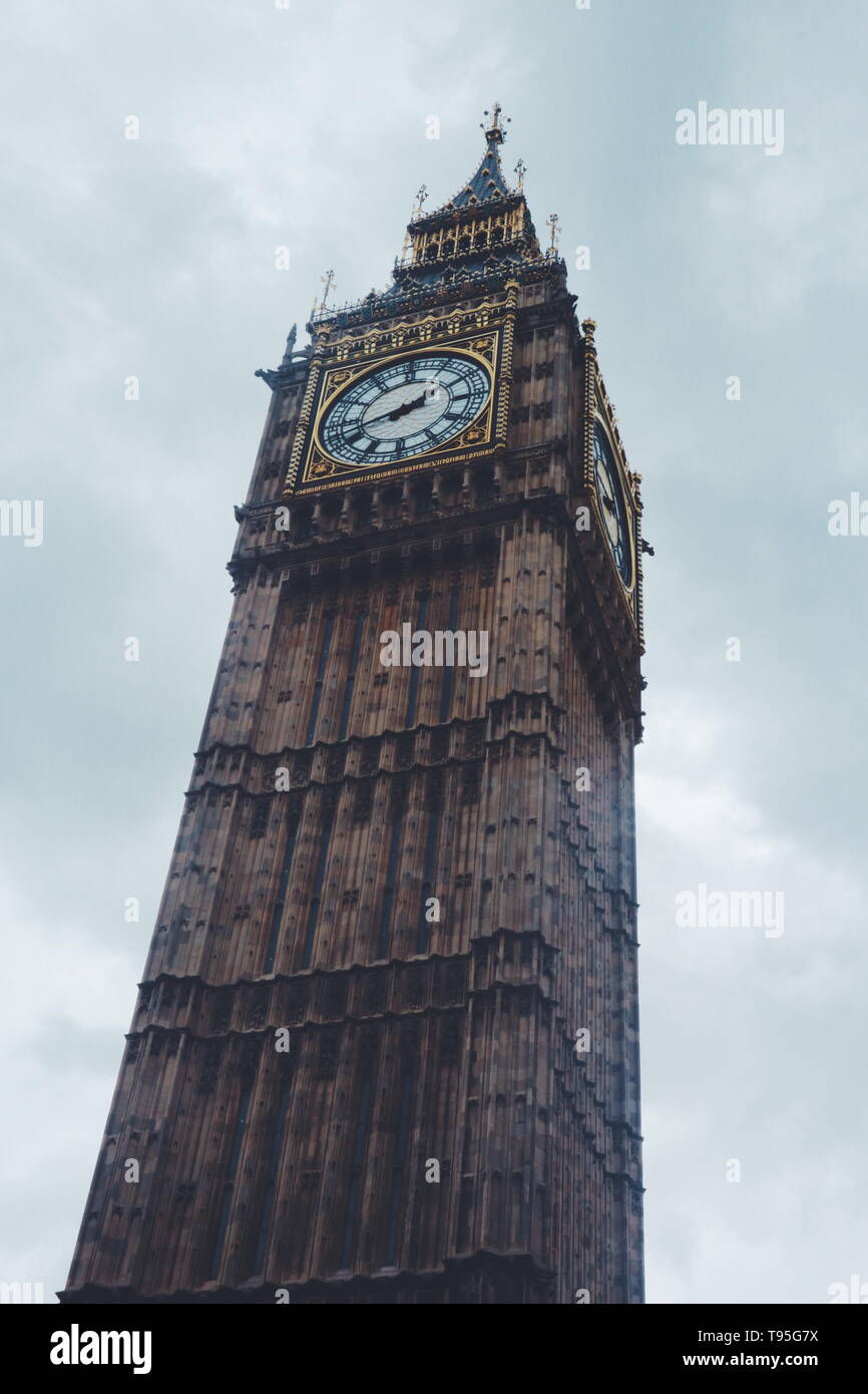 The Elizabeth Tower or known as 'Big Ben' shot in a low-angle shot on a cloudy day Stock Photo