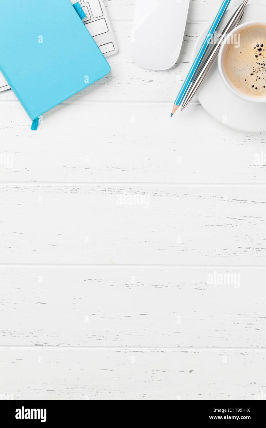 Office workplace table with coffee cup, supplies and computer. Flat lay