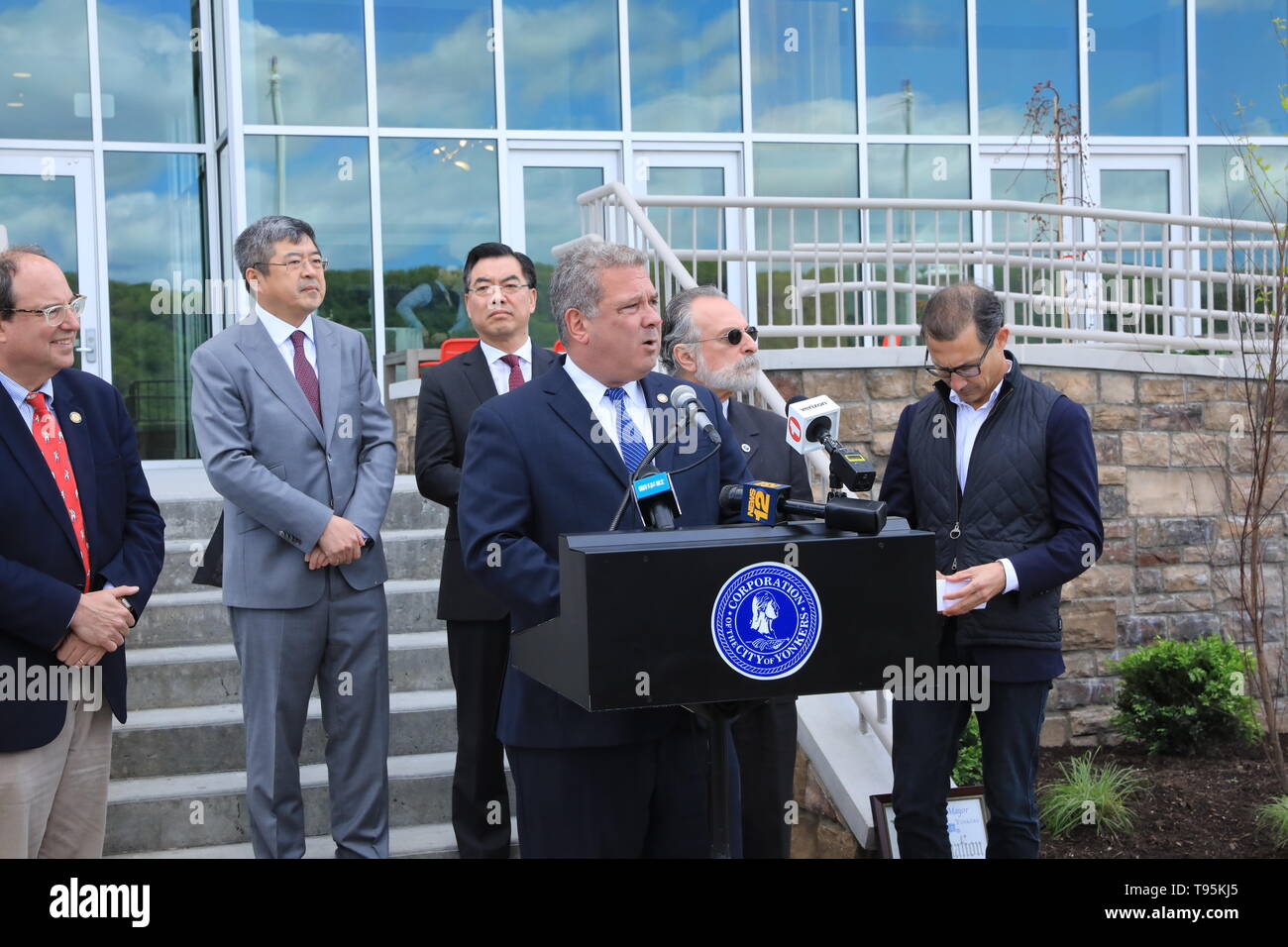 (190516) -- NEW YORK, May 16, 2019 (Xinhua) -- Mike Spano (C), mayor of Yonkers speaks during a ribbon-cutting ceremony in the city of Yonkers, in the U.S. state of New York, on May 15, 2019. A China-invested residential building officially opened on Wednesday in the city of Yonkers, in the U.S. state of New York. The River Club at Hudson Park, a 214-unit luxury apartment building, is a public-private partnership project developed by China Construction America (CCA) since 2015. It helped complete the three-phased Hudson Park development plan that was started more than two decades ago, which ai Stock Photo