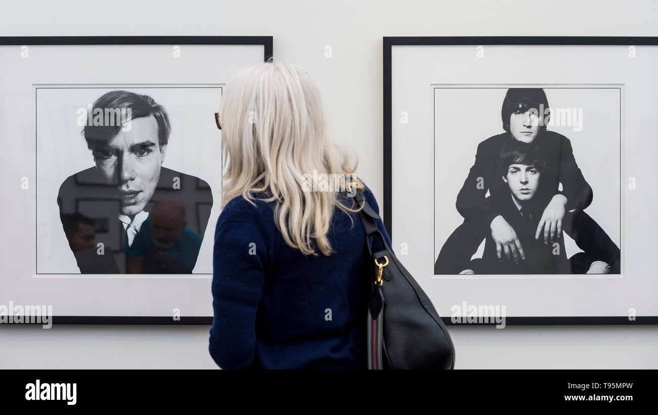 London, UK.  16 May 2019.  A woman views 'Andy Warhol', 1965, (L) and 'John Lennon & Paul McCartney', 1965, (R), both by David Bailey at Photo London 2019 at Somerset House.  The event showcases the best in contemporary photography from over 100 world class galleries for collectors and enthusiasts.  The festival runs 16 to19 May 2019.  Credit: Stephen Chung / Alamy Live News Stock Photo