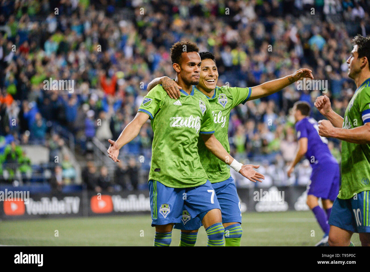 Seattle, Washington, USA. 15th May, 2019. The Sounders Raul Ruidiaz (9) and Bwana (70) celebrate a 2nd half goal by Bwana as Orlando City visits the Seattle Sounders for an MLS match at Century Link Field in Seattle, WA. Credit: Jeff Halstead/ZUMA Wire/Alamy Live News Stock Photo