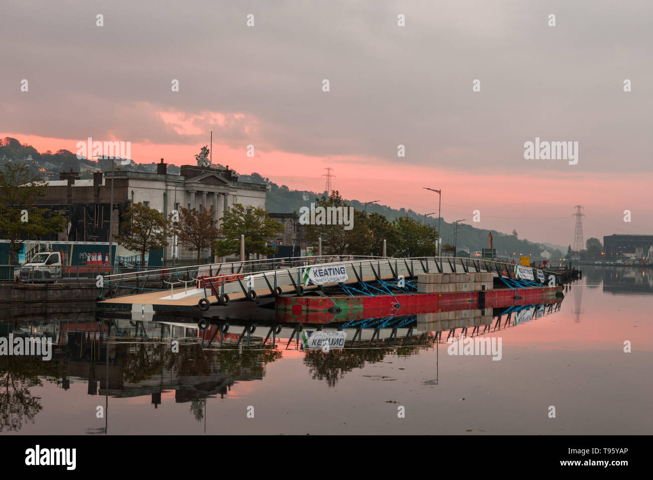 Cork City, Cork, Ireland. 17th May, 2019. The new Mary Elmes Bridge moored overnight at Penrose Quay awaitng a low tide so it can be taken upstream and lowered by crane in position connecting Patrick's and Merchants Quay's in Cork City, Ireland. Credit: David Creedon/Alamy Live News Stock Photo