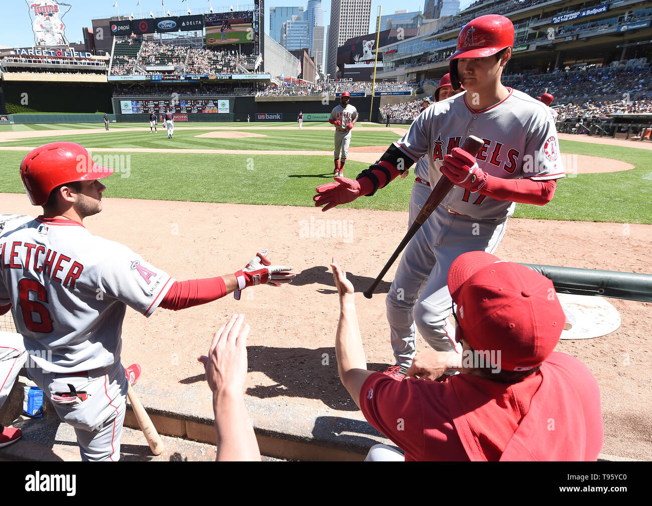 Los Angeles Angels designated hitter Shohei Ohtani celebrates with teammate  David Fletcher (L) in the dugout after scoring on a sacrifice fly by Brian  Goodwin #18 in the seventh inning during the