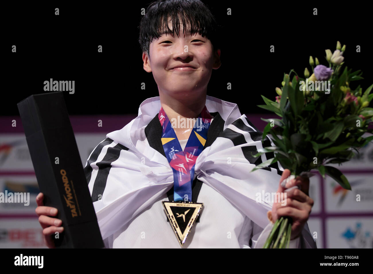 Manchester. 16th May, 2019. South Korea's Da-Bin Lee poses with her medal after winning gold against Mexico's Maria Espinoza in the final of the women's -73kg category at the World Taekwondo Championships 2019 in Manchester, Britain on May 16, 2019. Credit: Jon Super/Xinhua/Alamy Live News Stock Photo