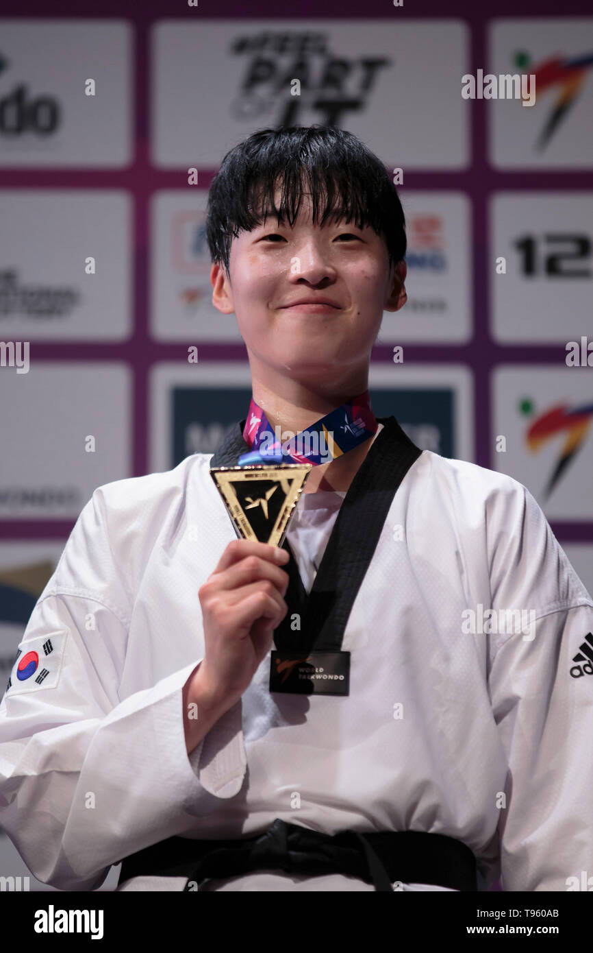 Manchester. 16th May, 2019. South Korea's Da-Bin Lee holds her medal after winning gold against Mexico's Maria Espinoza in the final of the women's -73kg category at the World Taekwondo Championships 2019 in Manchester, Britain on May 16, 2019. Credit: Jon Super/Xinhua/Alamy Live News Stock Photo