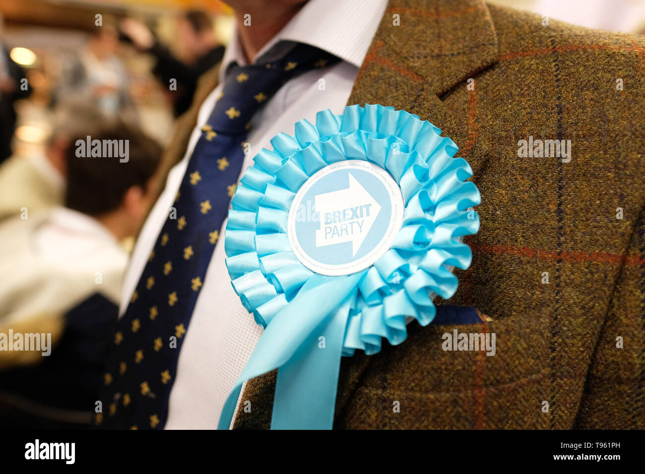 Dudley, West Midlands, England, UK - Friday 17th May 2019 – A Brexit Party candidate wears a rosette during the Brexit Party tour event at Dudley, West Midlands ahead of next weeks European Parliament elections – The town of Dudley voted 67% in favour of leaving the EU in the 2016 referendum. Photo Steven May / Alamy Live News Stock Photo