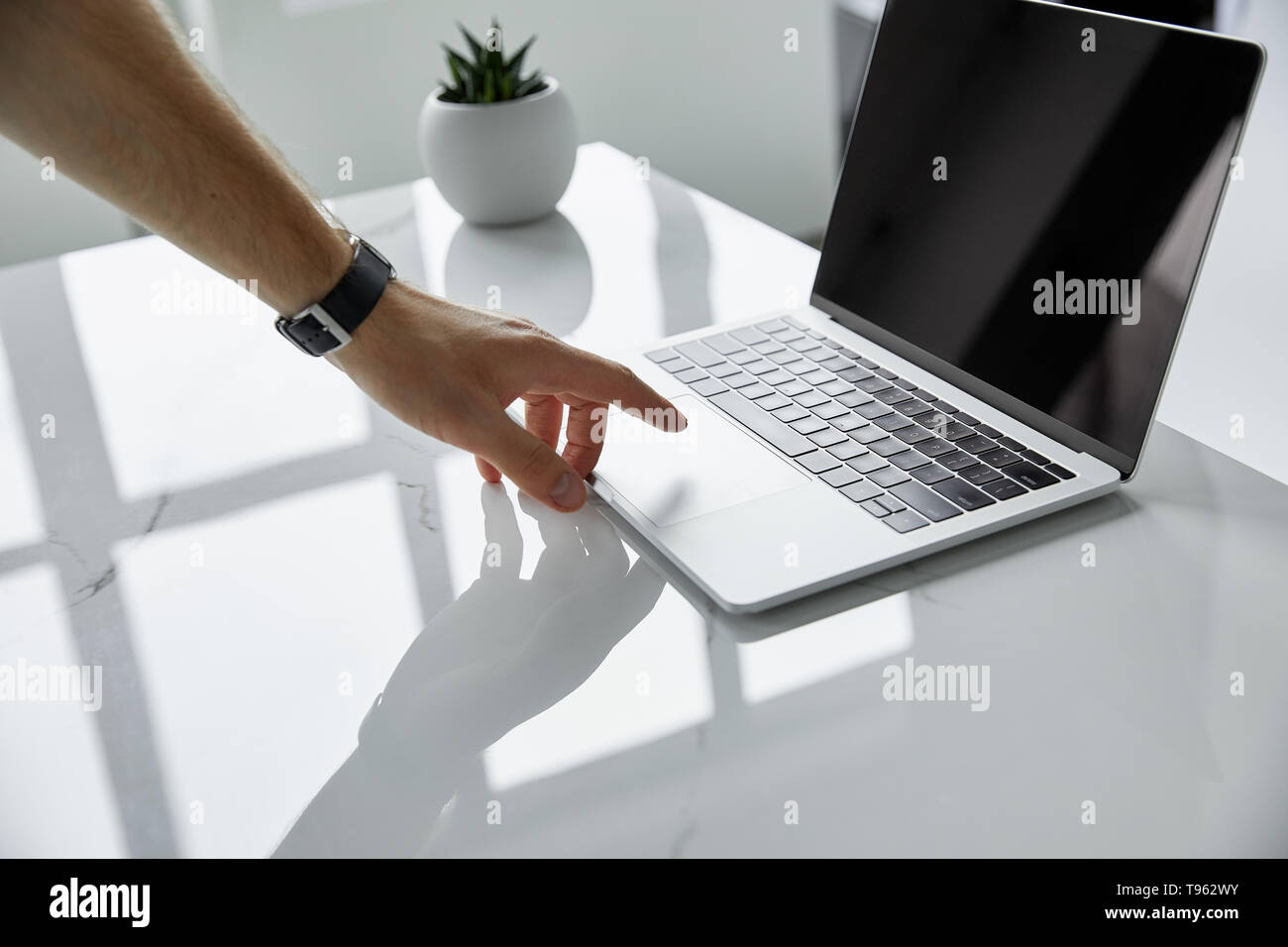 selective focus of man touching laptop with blank screen Stock Photo ...