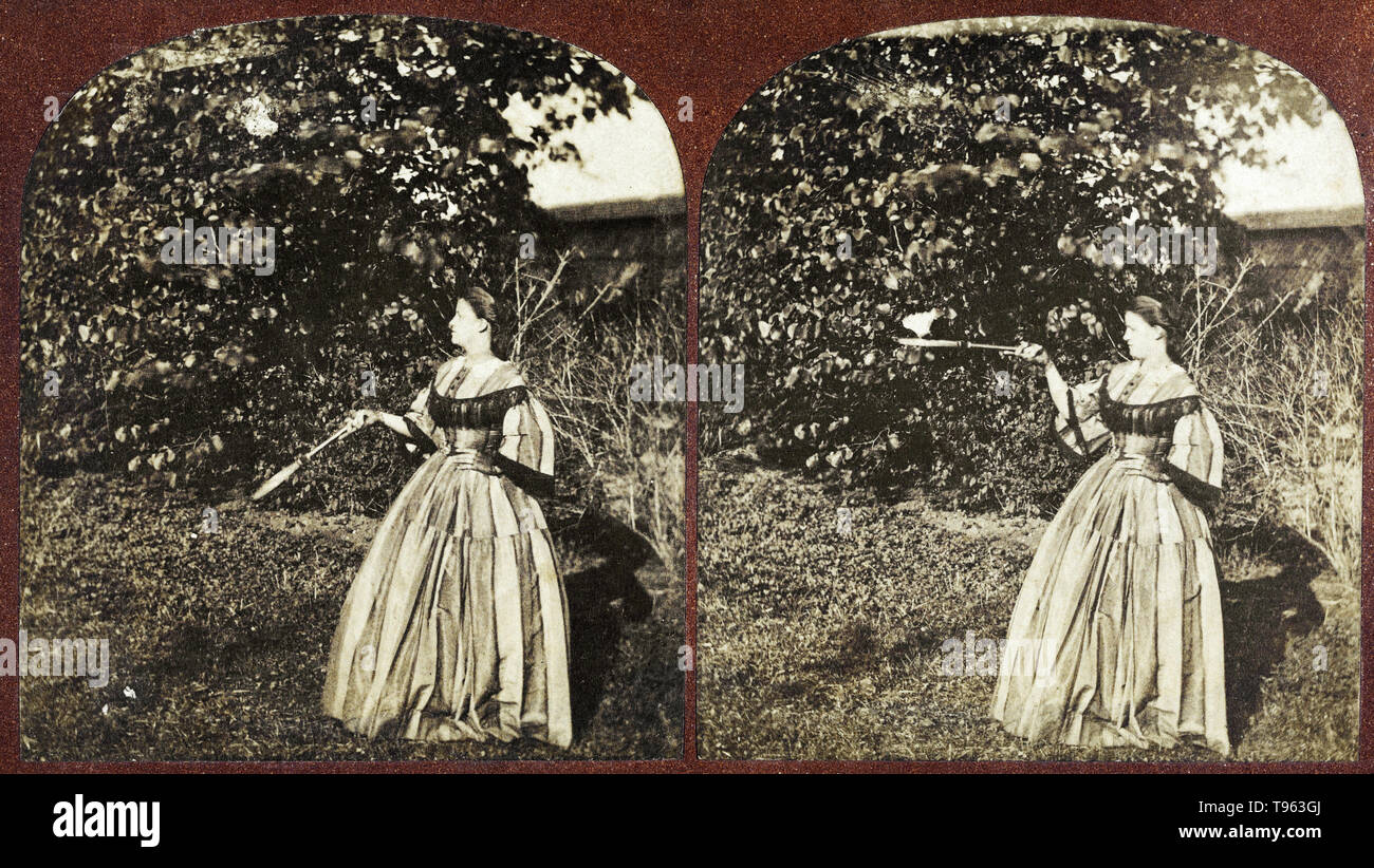 Woman bouncing shuttlecock on badminton racket in France, 1860s. Albumen silver print. Stock Photo