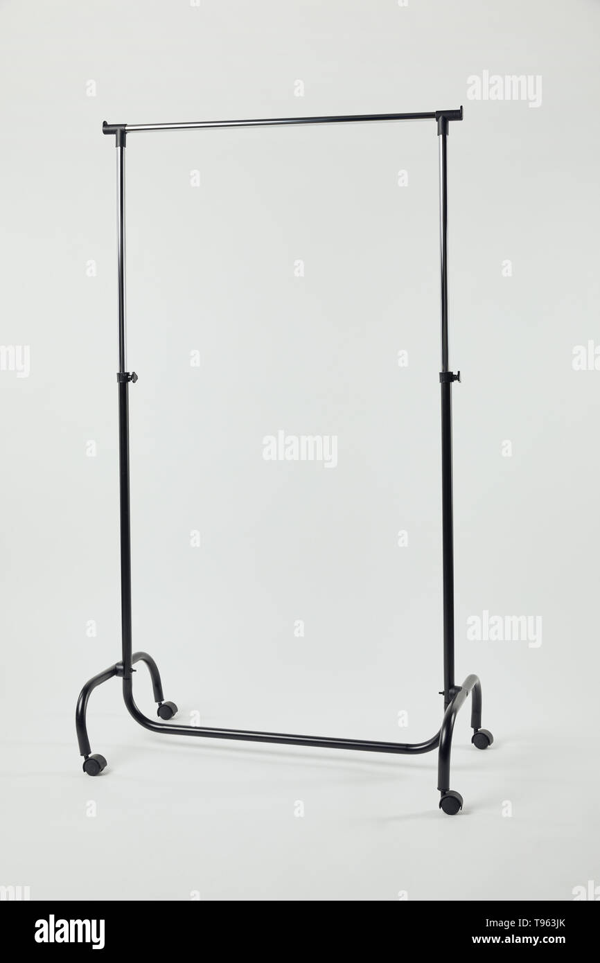 Black steel straight rack on wheels isolated on grey Stock Photo - Alamy