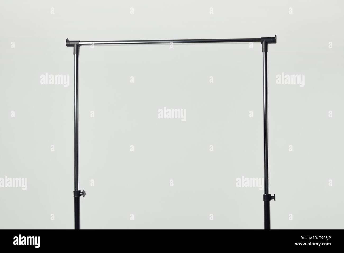Black steel straight rack isolated on light grey Stock Photo - Alamy