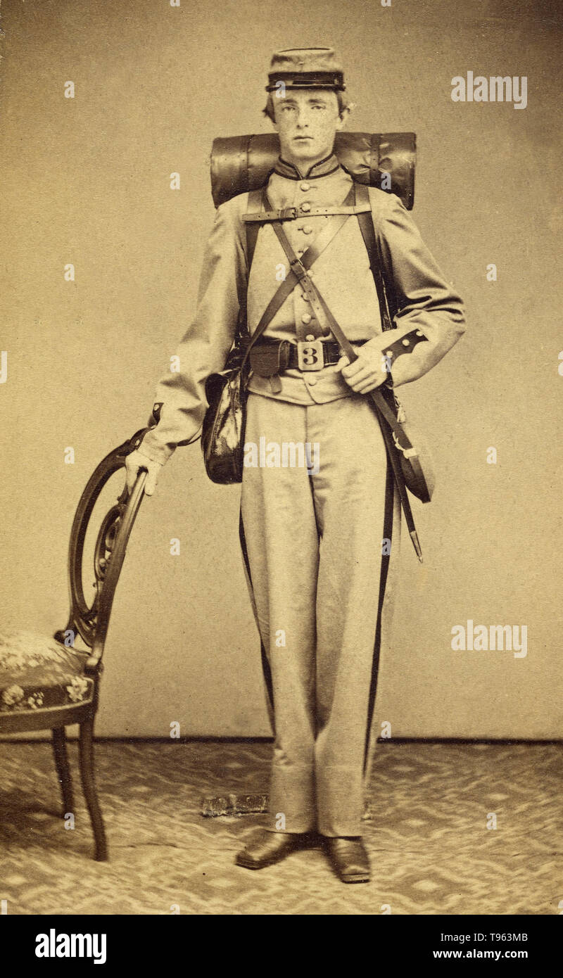 Unidentified Confederate soldier, standing, in uniform. Albumen silver print, c. 1862 - 1865. Stock Photo