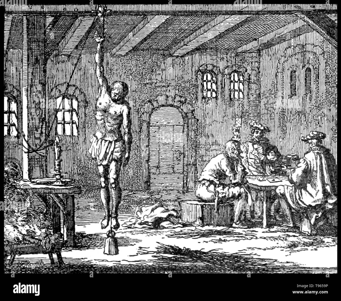 The strappado is a form of torture wherein the victim has his or her arms tied behind their back; a large rope is then tied to the wrists and passed over a pulley, beam, or a hook on the roof. The torturer pulls on this rope until the victim is hanging from the arms. Since the hands are tied behind the victim's back, this will cause a very intense pain and possible dislocation of the arms. Stock Photo