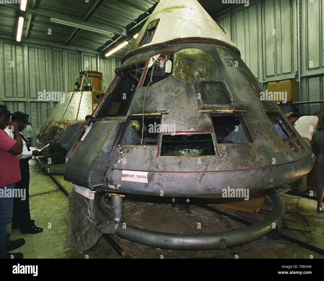Apollo 1 wreckage inspection. Lawyer and technical expert Scott Grissom viewing the wreckage of the Apollo 1 command module. The Apollo 1 mission (originally Apollo/Saturn 204) resulted in disaster on January 27th 1967 when a fire broke out in the command module during a launch pad test in which all three of the primary crew died. Astronauts Virgil 'Gus' Ivan Grissom, Edward Higgins White II, and Roger Bruce Chaffee died in the accident. Stock Photo