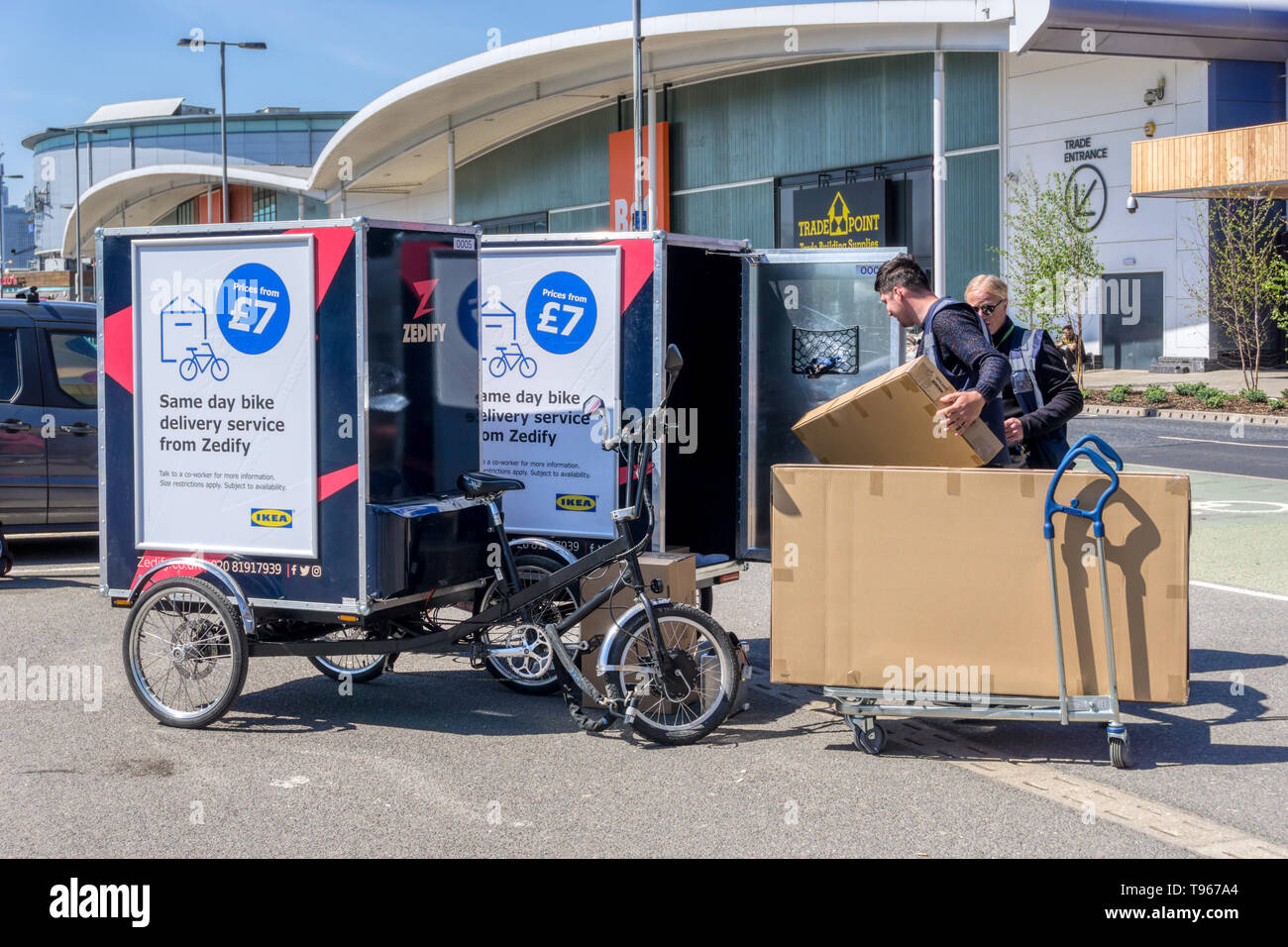 Zedify bike delivery service with riders loading parcels for delivery from IKEA store on Greenwich Peninsula. Stock Photo