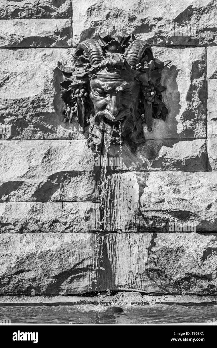 Water drains from this gargoyle of Bacchus, at the Biltmore Estate in Asheville, NC, USA Stock Photo