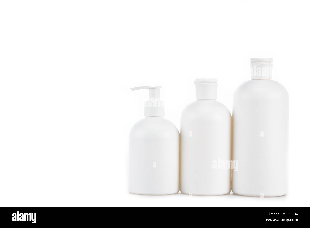 Three plastic white cosmetic bottles isolated on white Stock Photo - Alamy