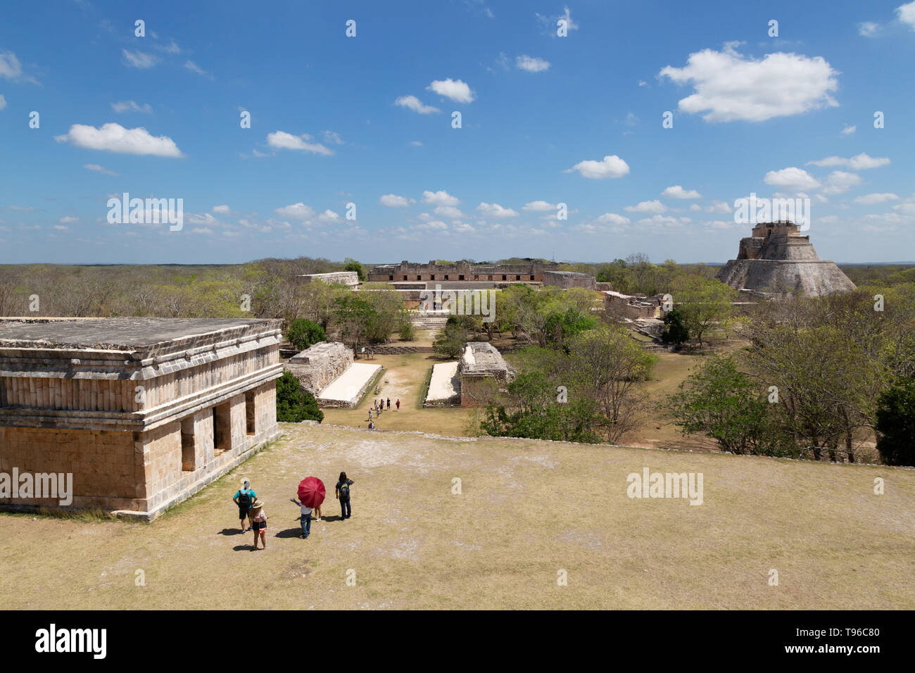 Uxmal Mexico - view of the Mayan ruins looking past the house of the Turtles towards the Nunnery Quadrangle and Pyramid of the Magician, Latin America Stock Photo