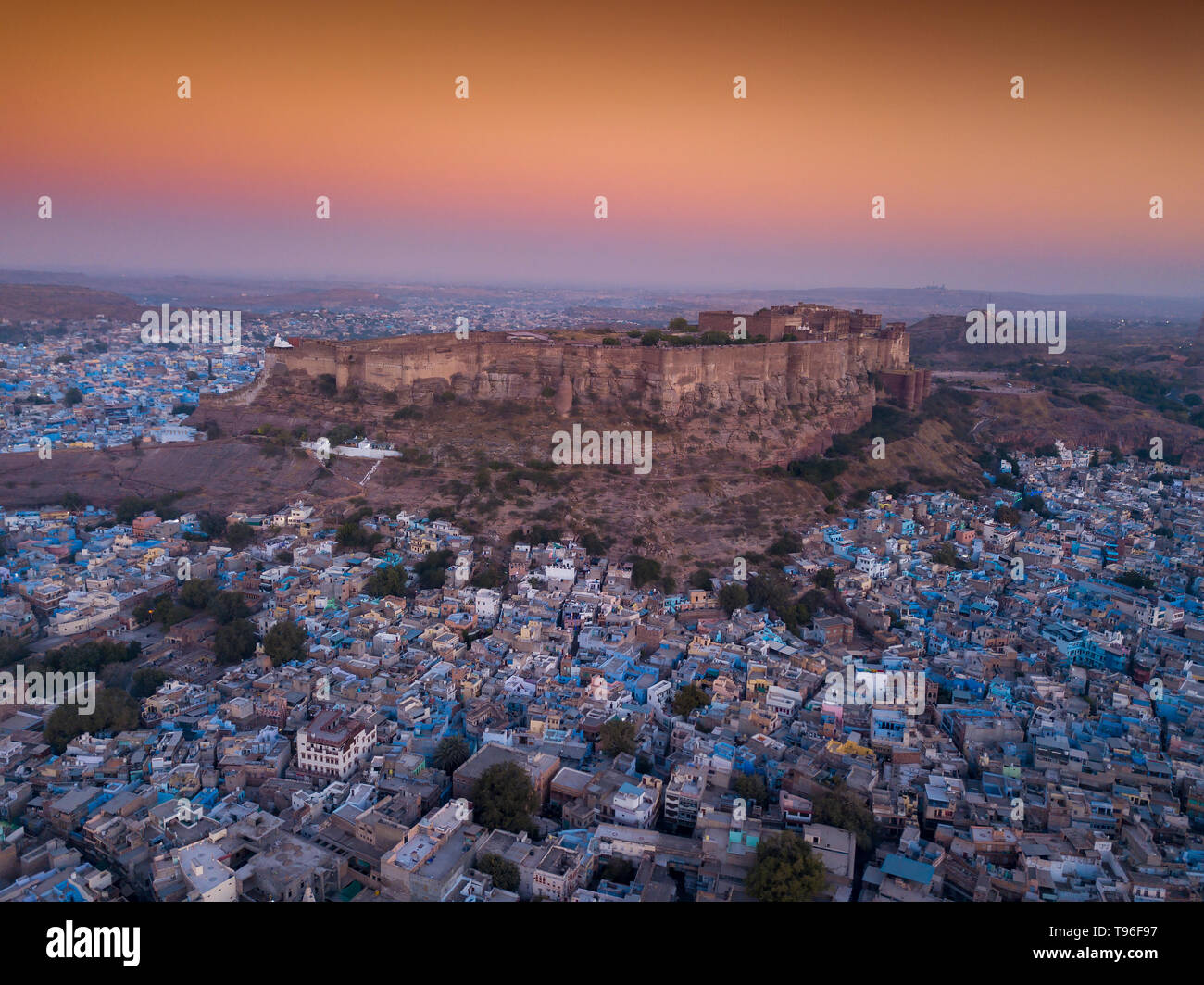 Aerial view of Mehrangarh Fort at sunset sits above the 'Blue City