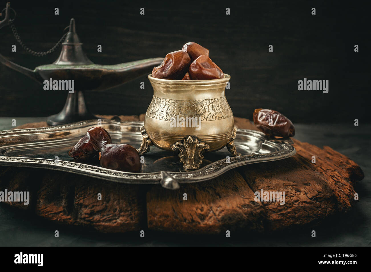 Dried date palm fruits or kurma, ramadan food. Beautiful bowl full of date fruits symbolizing Ramadan. Close -up. Stock Photo