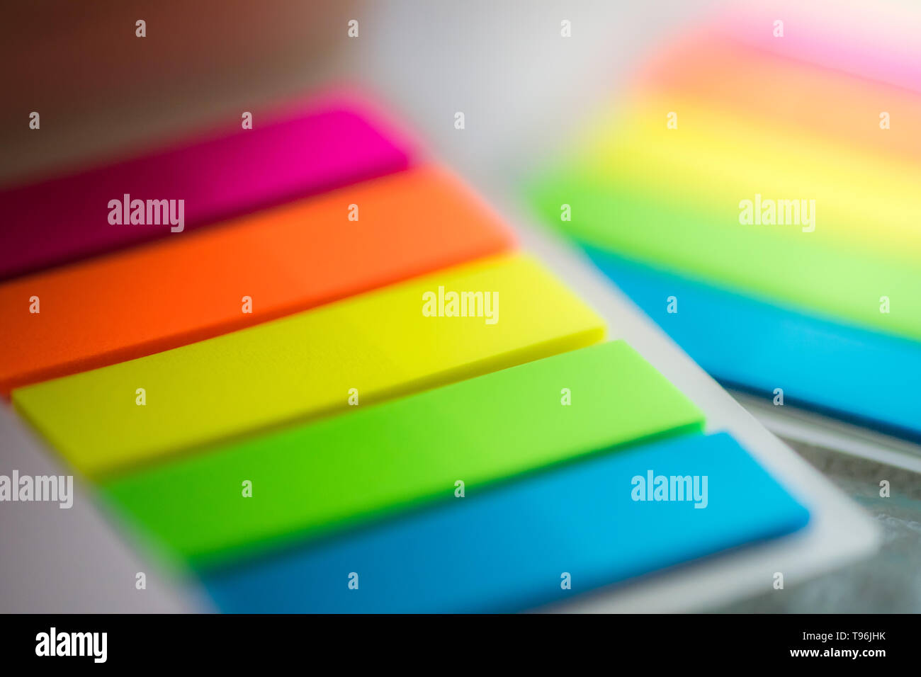 blurred background multicolored notes in a notebook Stock Photo