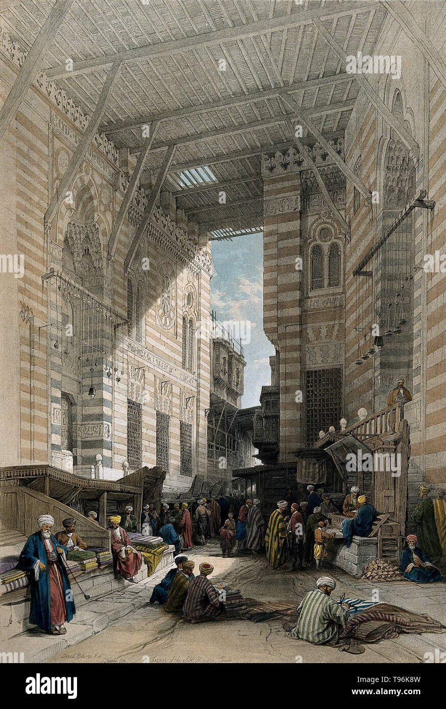 The bazaar of the silk merchants in Cairo with a man smoking a long-stemmed pipe. A bazaar is a permanently enclosed marketplace or street where goods and services are exchanged or sold. Colored lithograph by L. Haghe, c. 1848, after David Roberts. Stock Photo