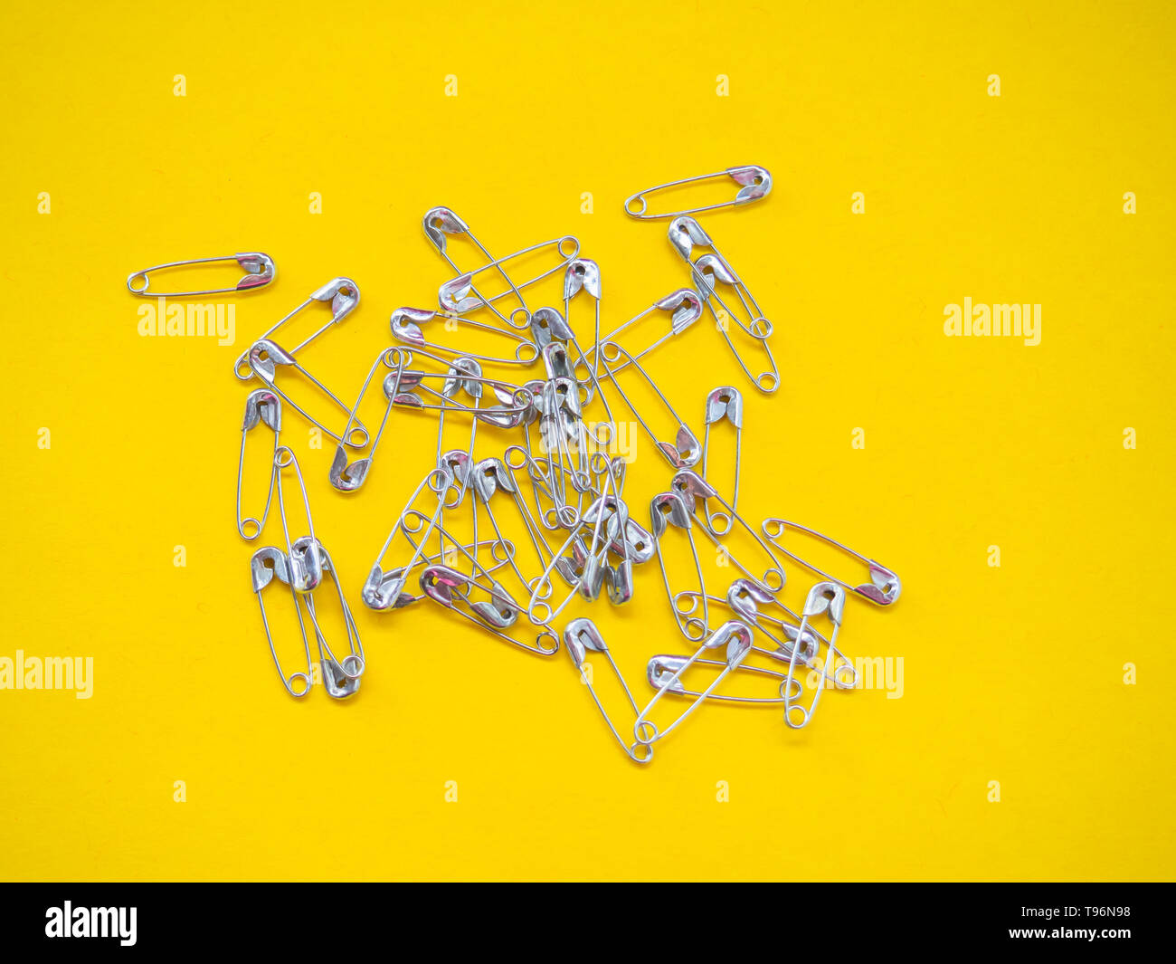 Lots of safety pins. Team concept Stock Photo Alamy