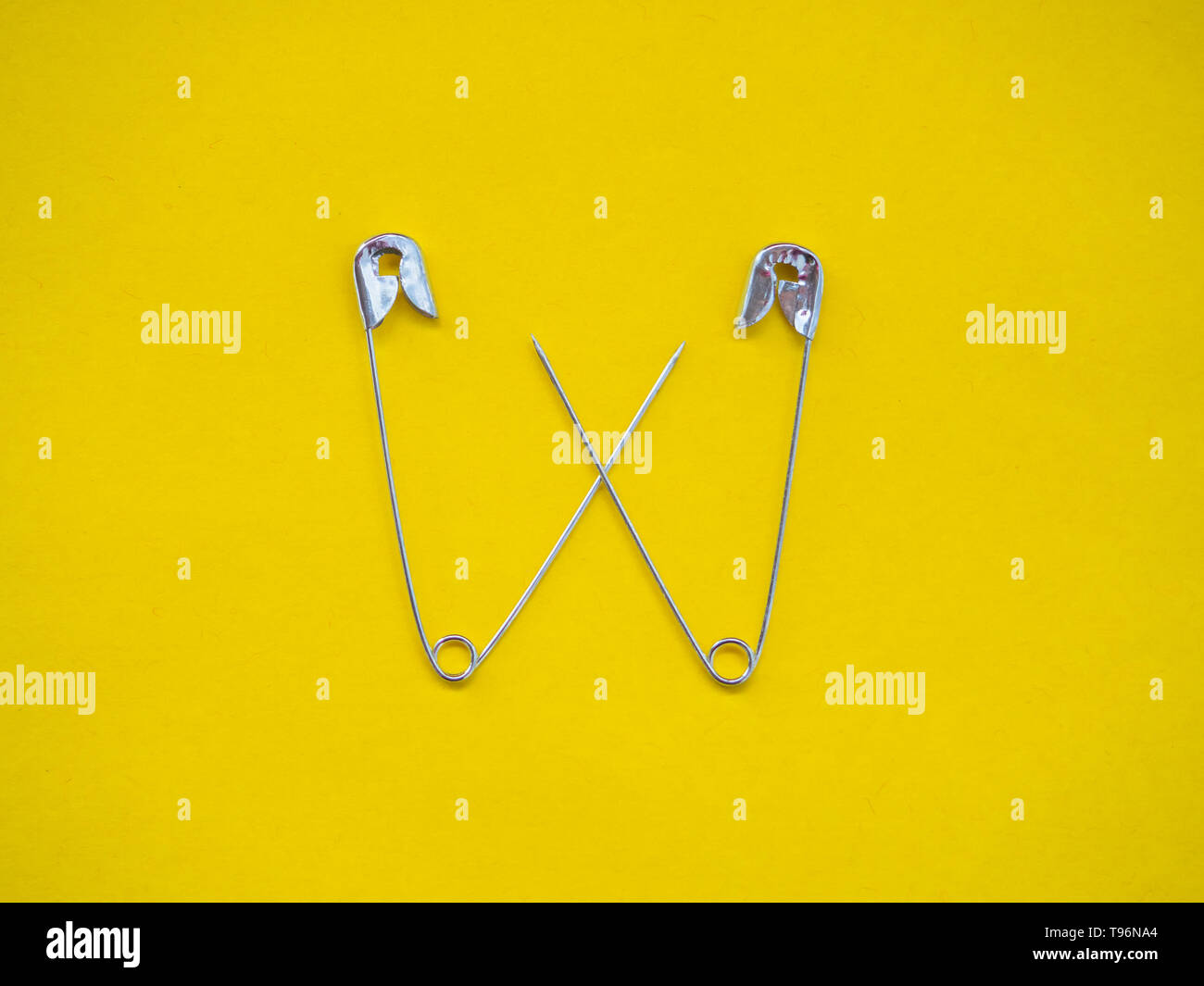 Lots of safety pins. Team concept Stock Photo Alamy