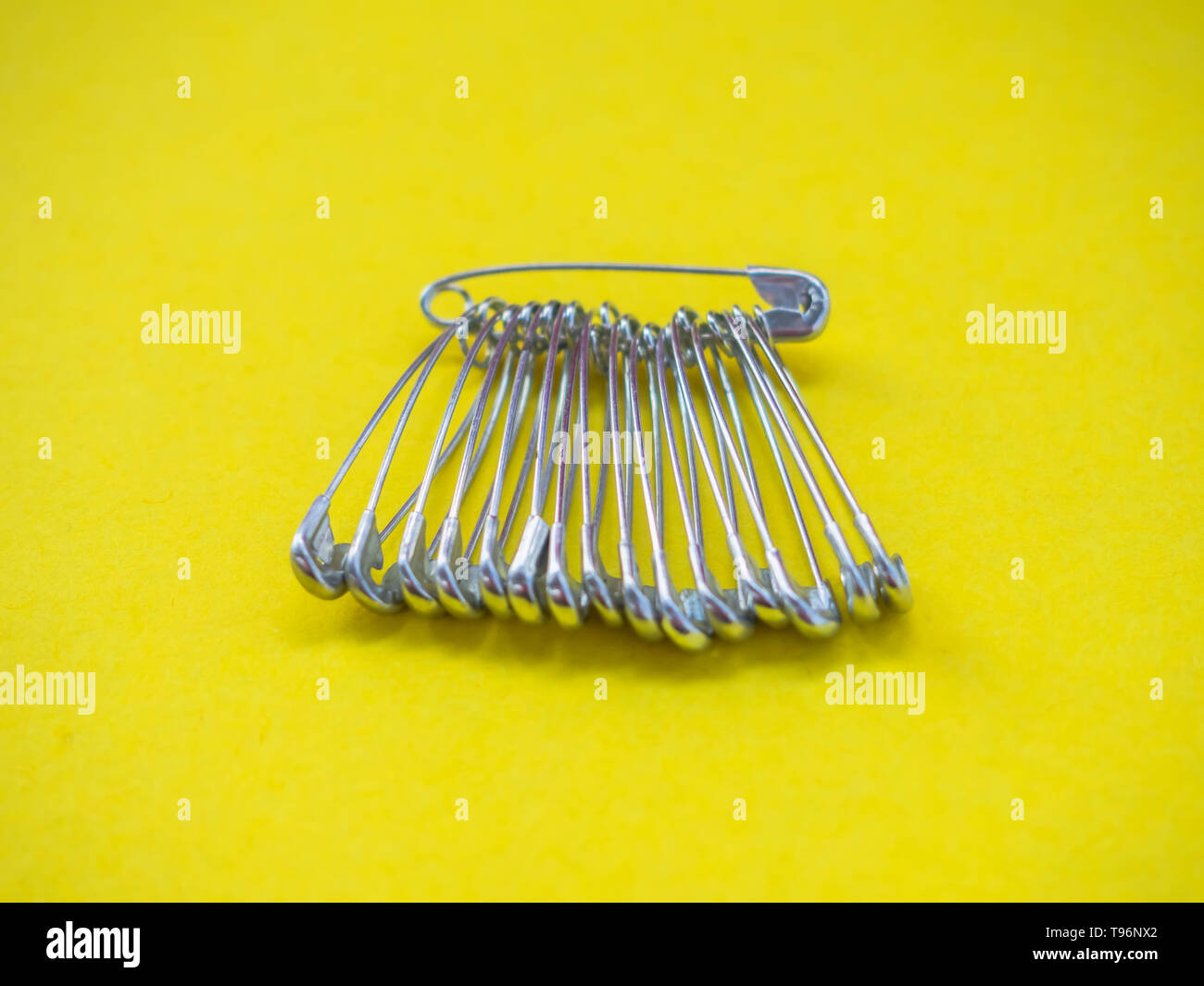 Lots of safety pins. Team concept Stock Photo Alamy