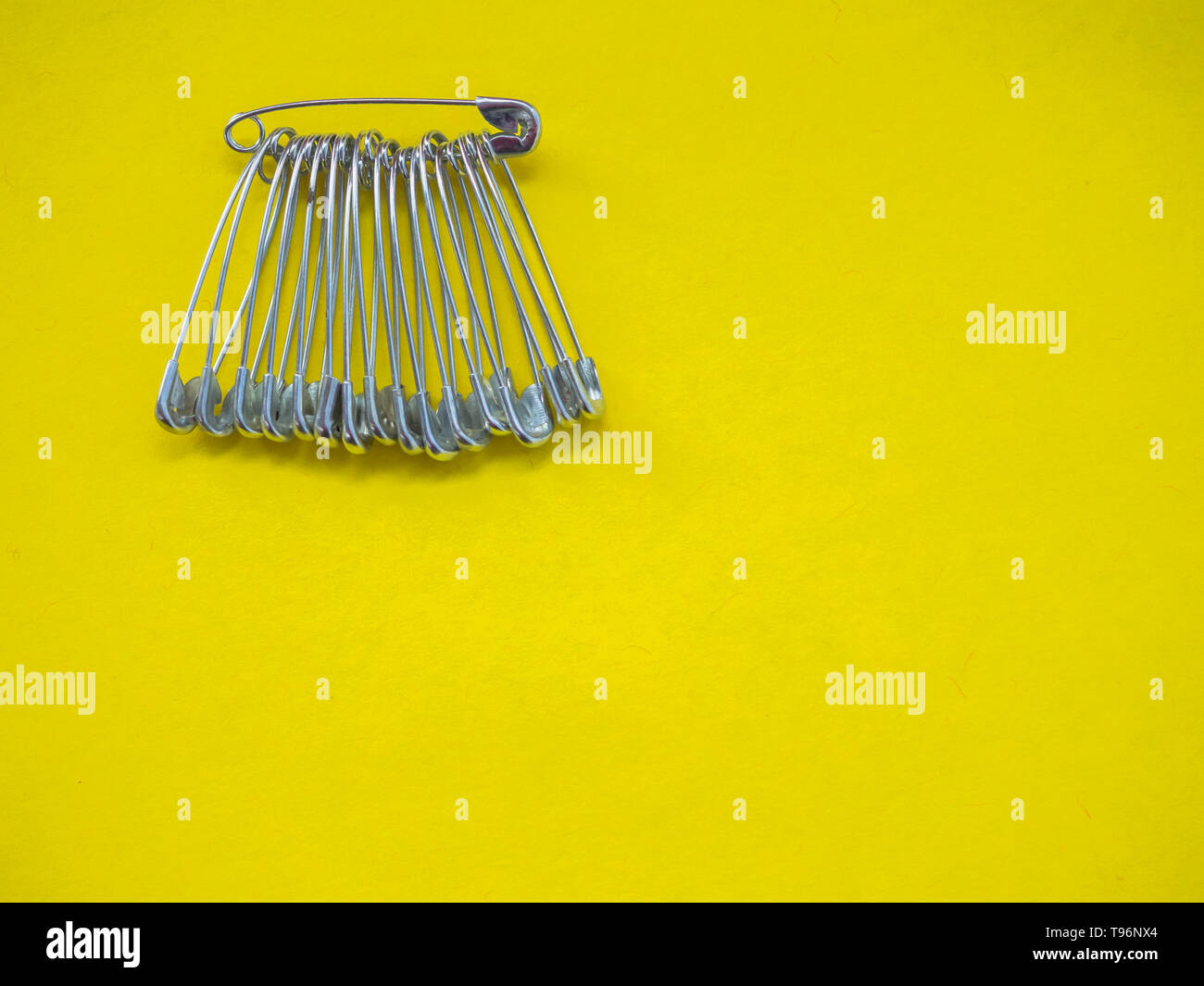 Lots of safety pins. Team concept Stock Photo Alamy