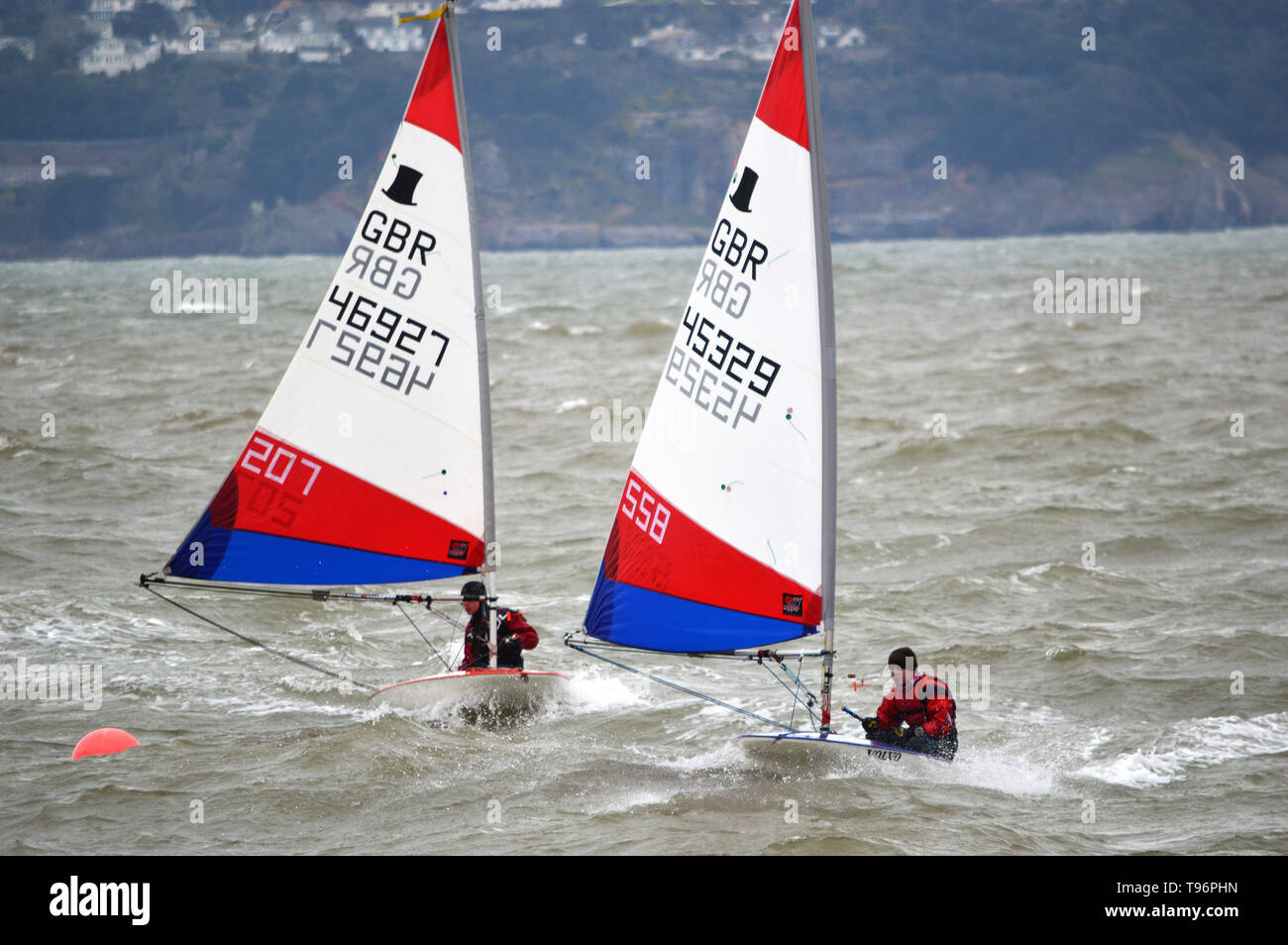 Two young sailing enthusiasts in Toppers at Paignton, Torbay, Devon, on Easter Sunday morninig, March 31, 2013 Stock Photo