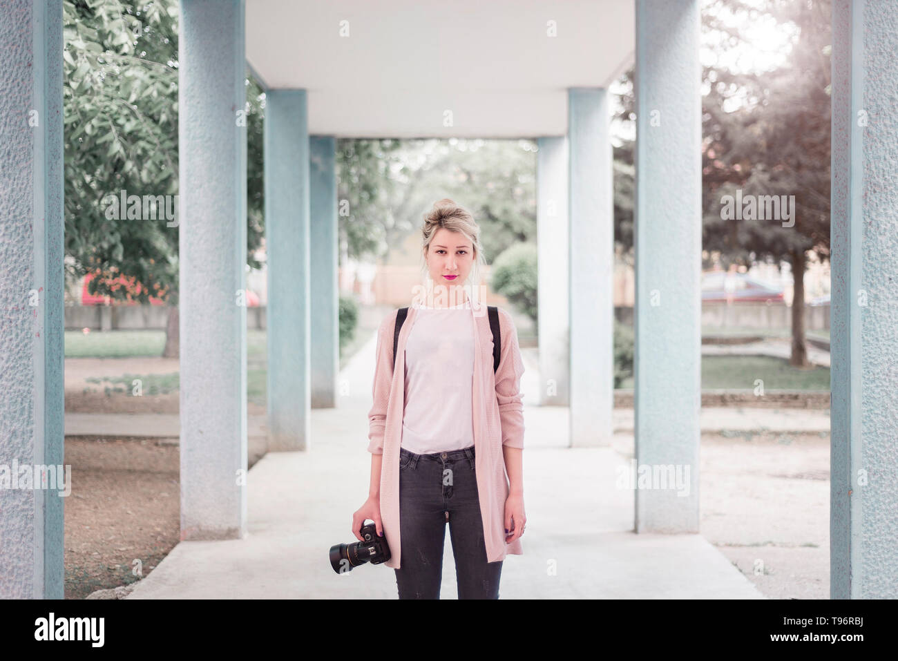 Young woman with camera portrait Stock Photo