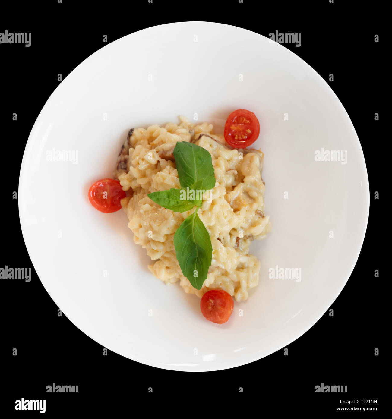 Creamy risotto in porcelain plate isolated on black background Stock Photo Alamy