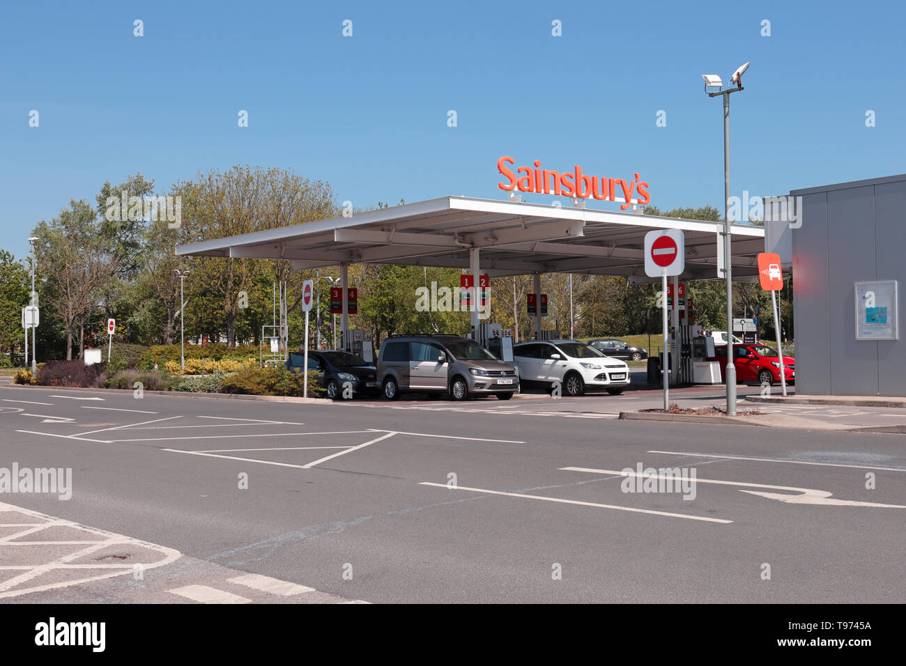 Cars filling up at Sainsburys Petrol Station on a waem sunny day Stock Photo