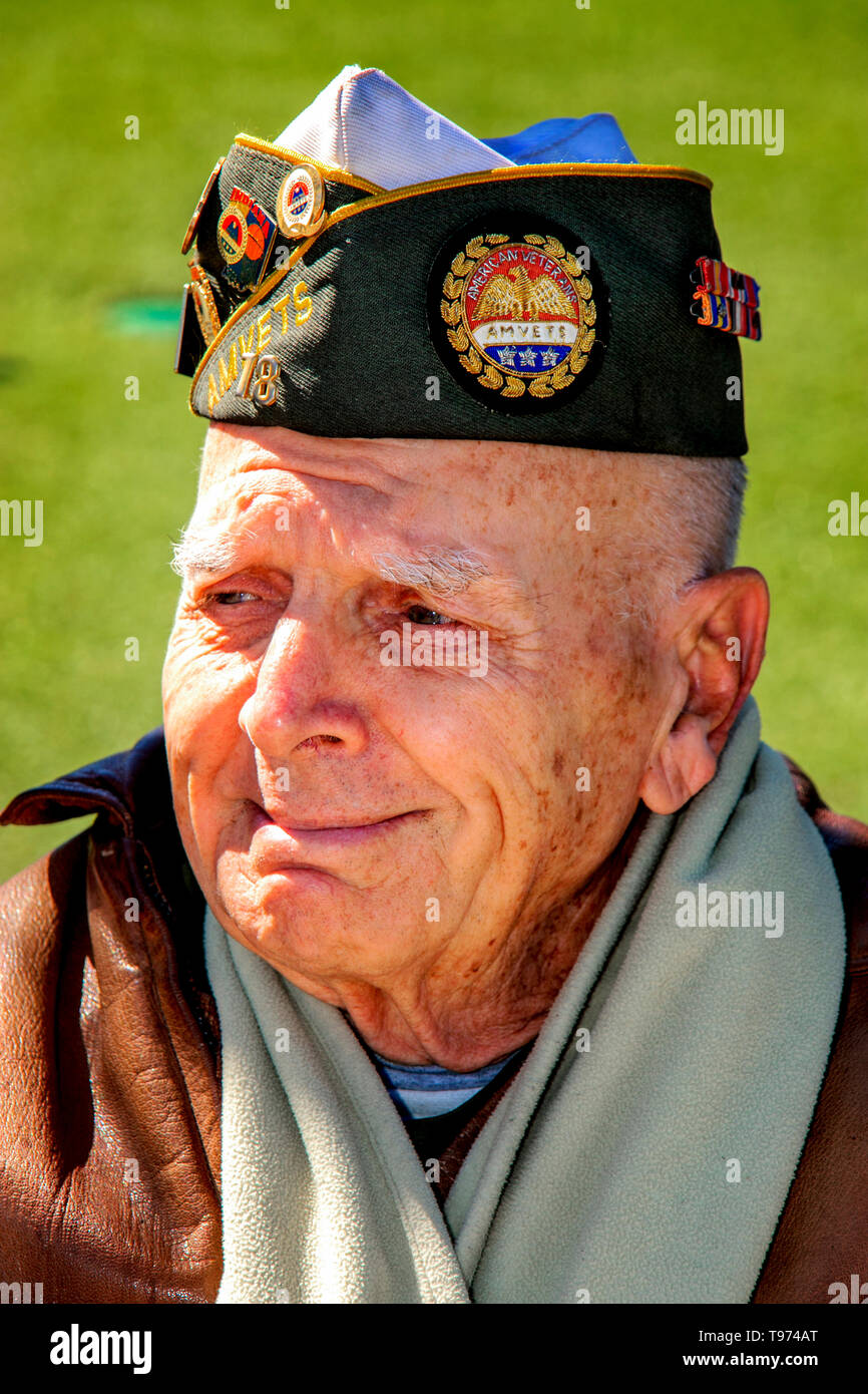 A retired military chaplain wearing an Amvets veterans association cap starts to cry at a patriotic celebration in Costa Mesa, CA. Stock Photo