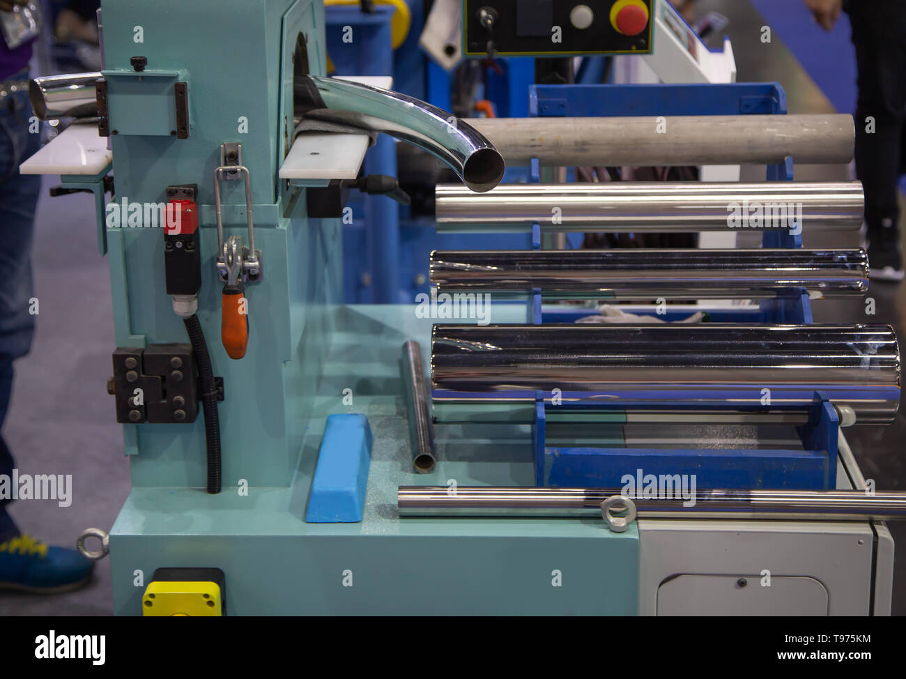 Curved tube process on pipe polishing machine Stock Photo