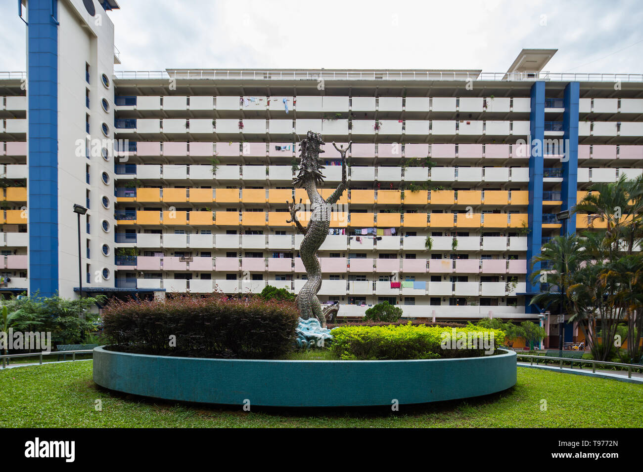 Slow travel into Whampoa neighbourhood to discover an iconic dragon sculpture design against the housing estate in background. Singapore Stock Photo