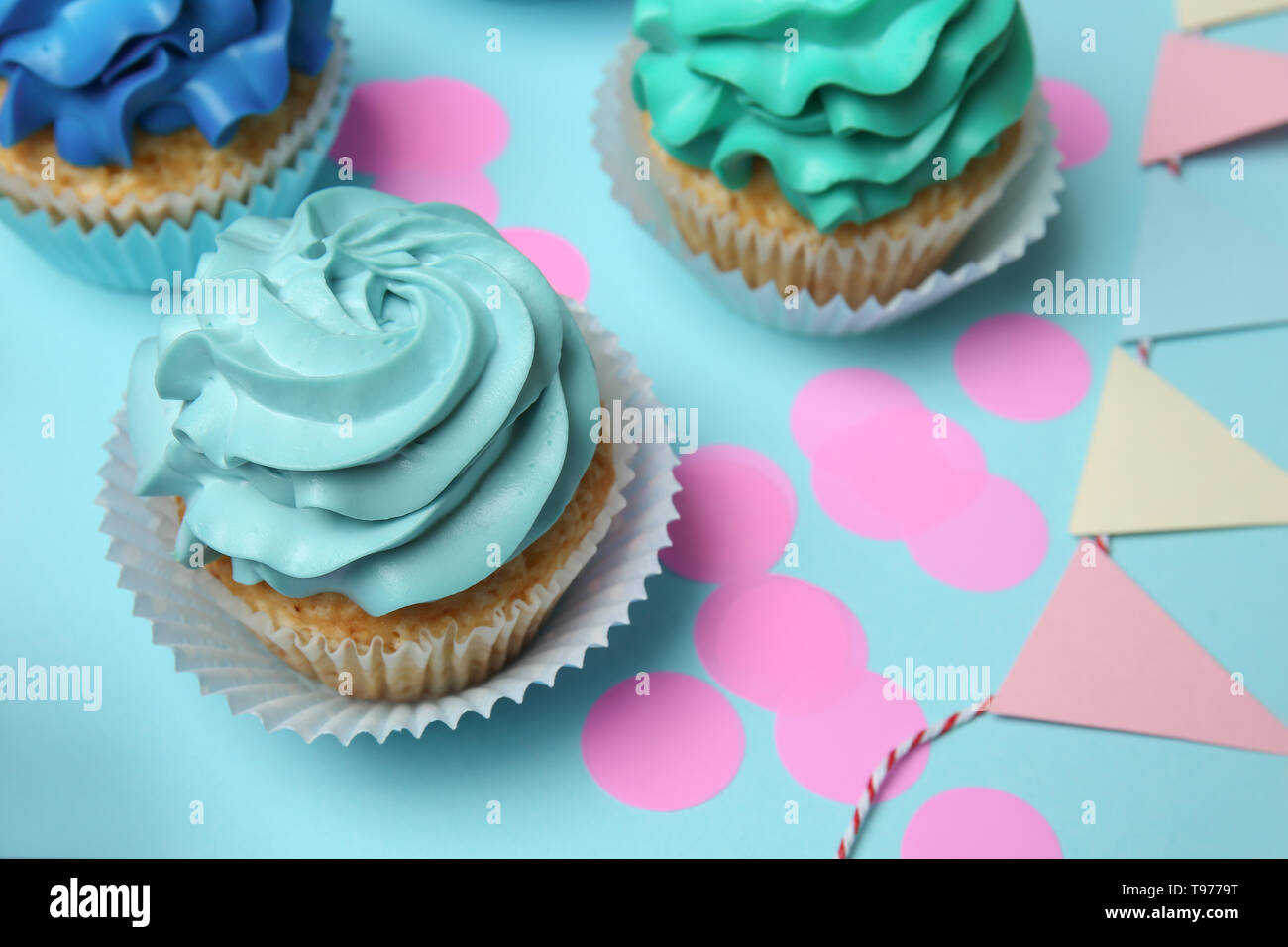 Different cupcakes on color background Stock Photo