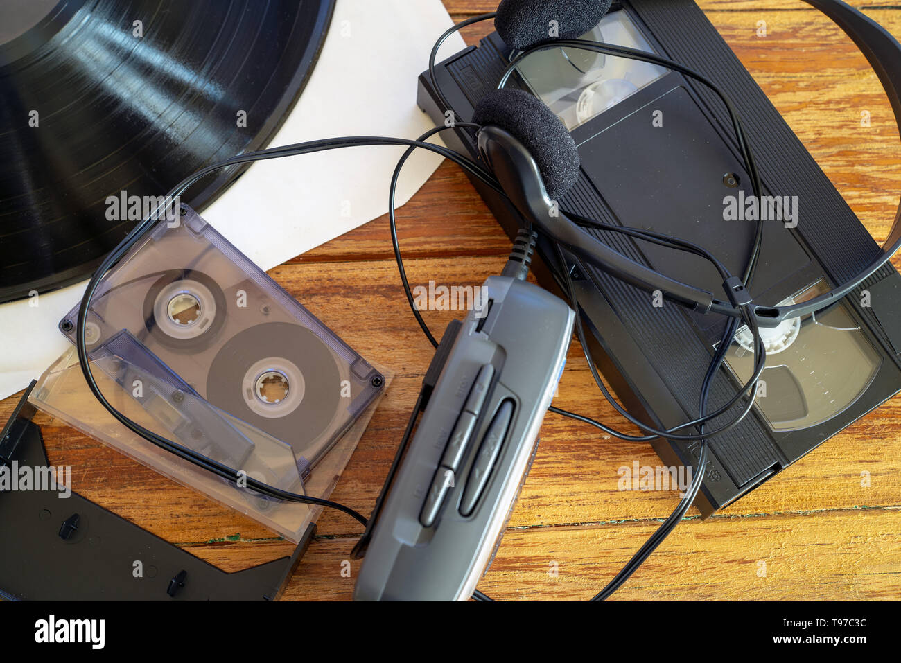 cassette tape, vinyl record, VHS video tape, walkman and headphones