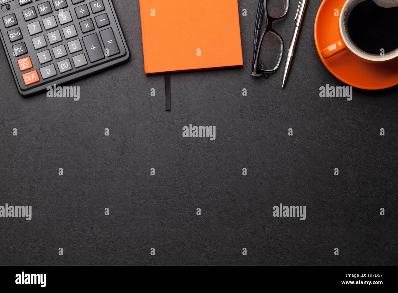 Office workplace table with coffee cup and supplies. Flat lay. Top view with space for your goals Stock Photo