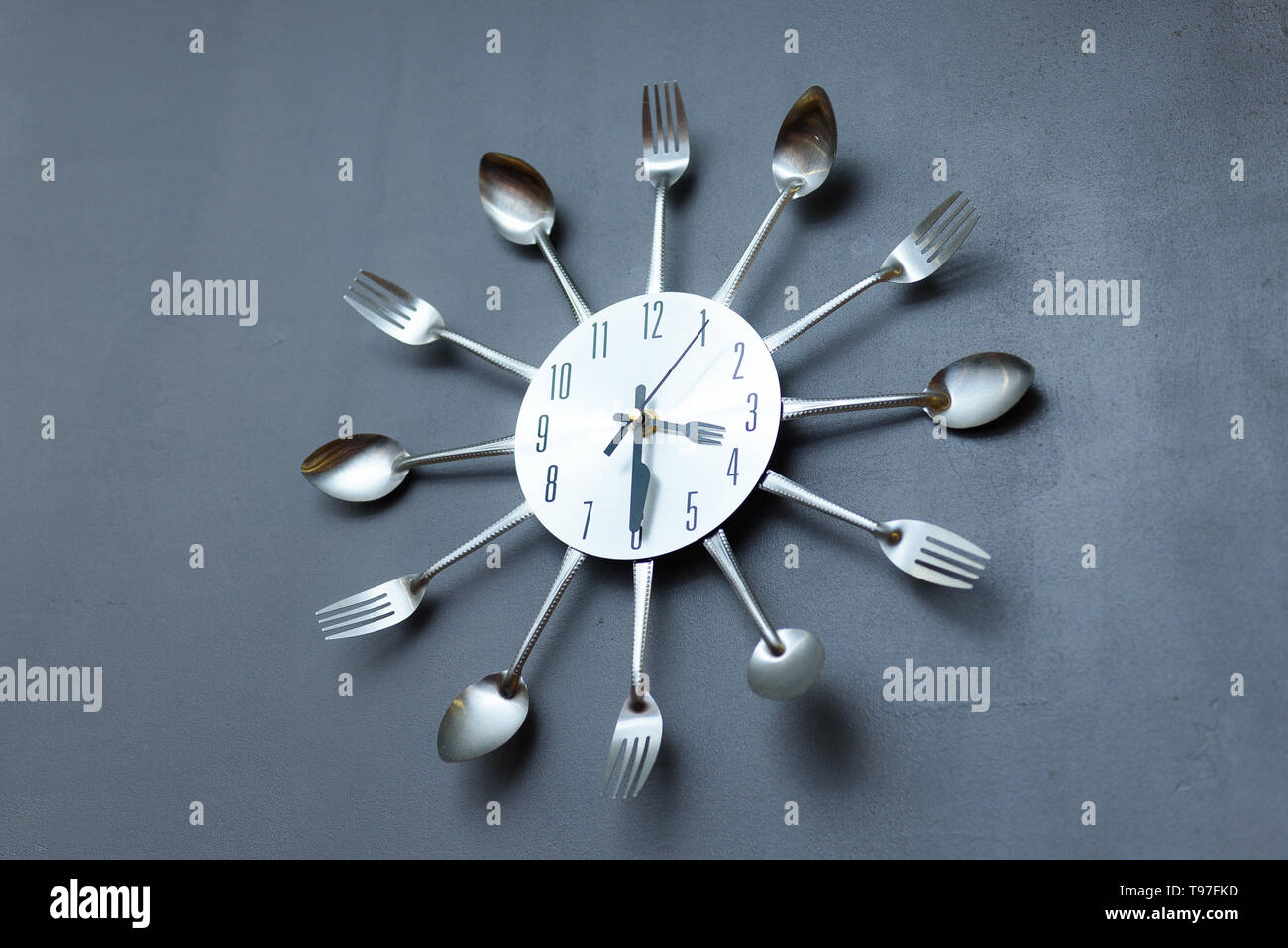 clock in the kitchen, cutlery gray Stock Photo Alamy