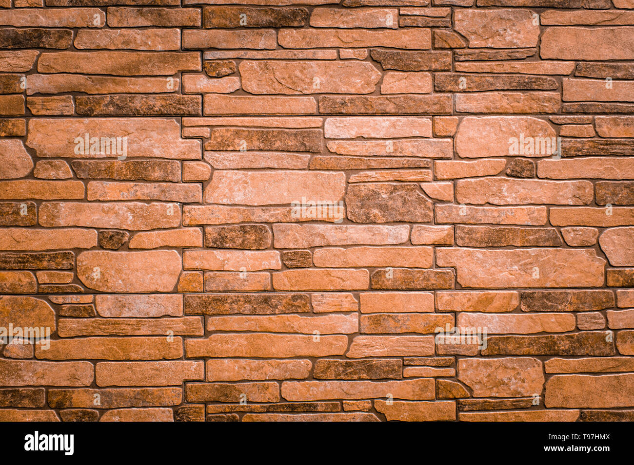 textured texture of light brown, old stone wall. Wallpaper for background design Photo -