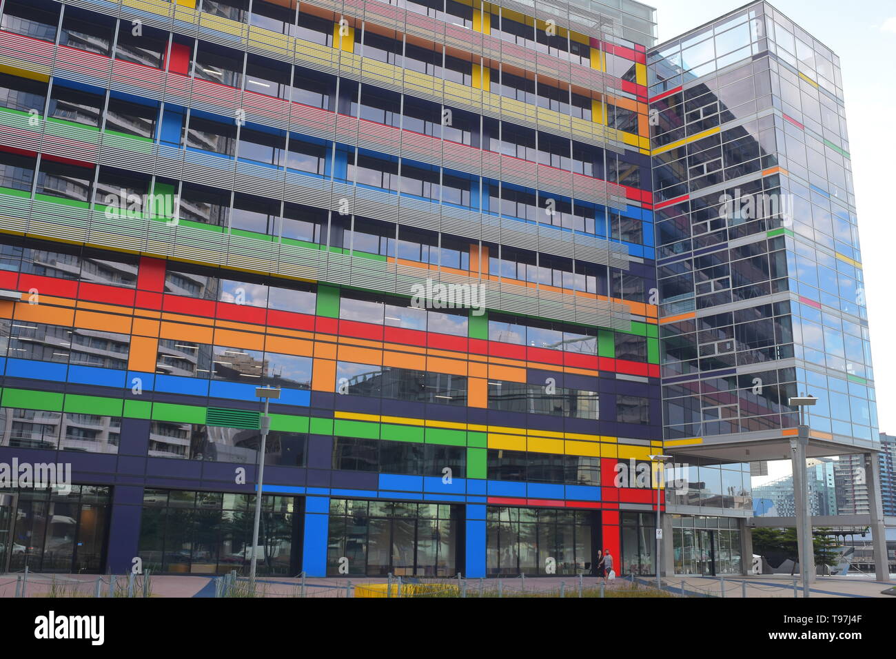 Modern office building with colorful panes on exterior walls. Stock Photo