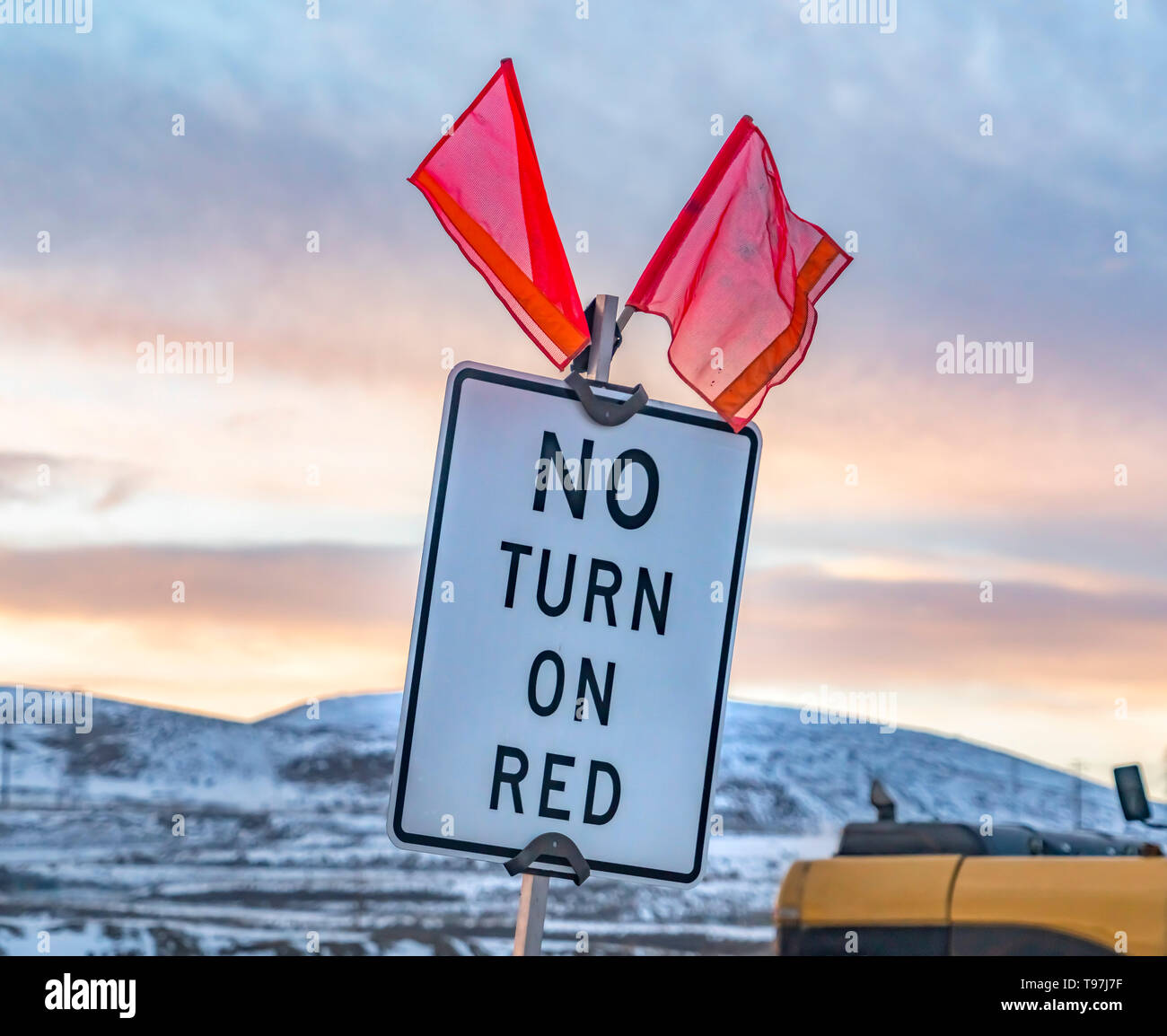 Close up of a No Turn On Red sign with red flags on top Stock Photo Alamy