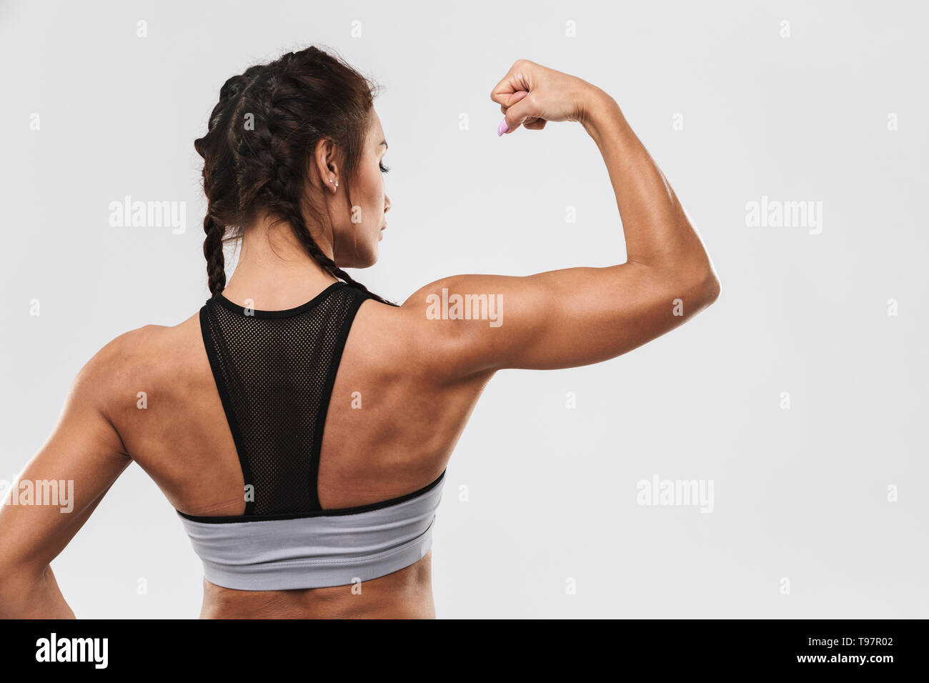 Back view image of a beautiful young amazing strong sports fitness