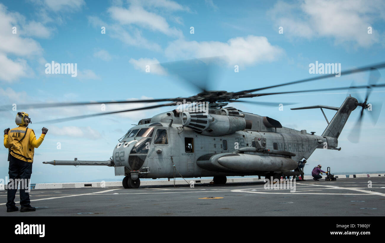 190501-M-QS181-0018 PACIFIC OCEAN (May 1, 2019) U.S. Marines with Marine Medium Tiltrotor Squadron (VMM) 163 (Reinforced), 11th Marine Expeditionary Unit (MEU), land a CH-53E Super Stallion aboard the flight deck of the San Antonio-class amphibious transport dock ship USS John P. Murtha (LPD 26). The Super Stallions transported Aviation Combat Element equipment aboard the USS John P. Murtha during routine operations as part of the Boxer Amphibious Ready Group. (U.S. Marine Corps photo by Cpl. Jason Monty) Stock Photo