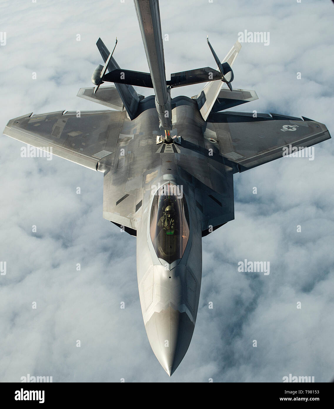 Airmen from the 6th and 9th Air Refueling Squadrons, Travis Air Force Base, Calif., use a U.S. Air Force KC-10 Extender to refuel a U.S Air Force F-22 Raptor, during exercise Northern Edge, May 14, 2019, at Joint Base Elmendorf-Richardson, Alaska. Units participating in Northern Edge have access to the Joint Pacific Alaska Range Complex, which is one of the largest training ranges in the world, with approximately 65,000 square miles of available airspace; 2,500 square miles of land and 42,000 square nautical miles of surface, subsurfaces and overlying airspace. (U.S. Air Force photo by Master  Stock Photo