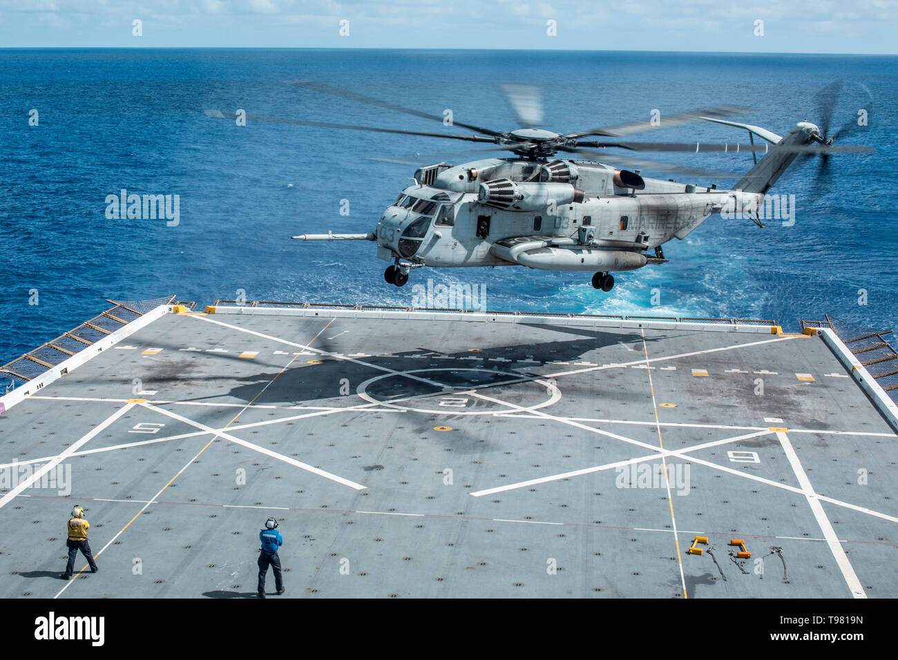 190513-M-QS181-0061 PACIFIC OCEAN (May 13, 2019) U.S. Marines with Marine Aircraft Group (MAG) 24 prepare to land a CH-53 Super Stallion on the flight deck of the San Antonio-class amphibious transport dock ship USS John P. Murtha (LPD 26). The Marines and Sailors of the 11th Marine Expeditionary Unit are conducting routine operations as part of the Boxer Amphibious Ready Group. (U.S. Marine Corps photo by Cpl. Jason Monty) Stock Photo