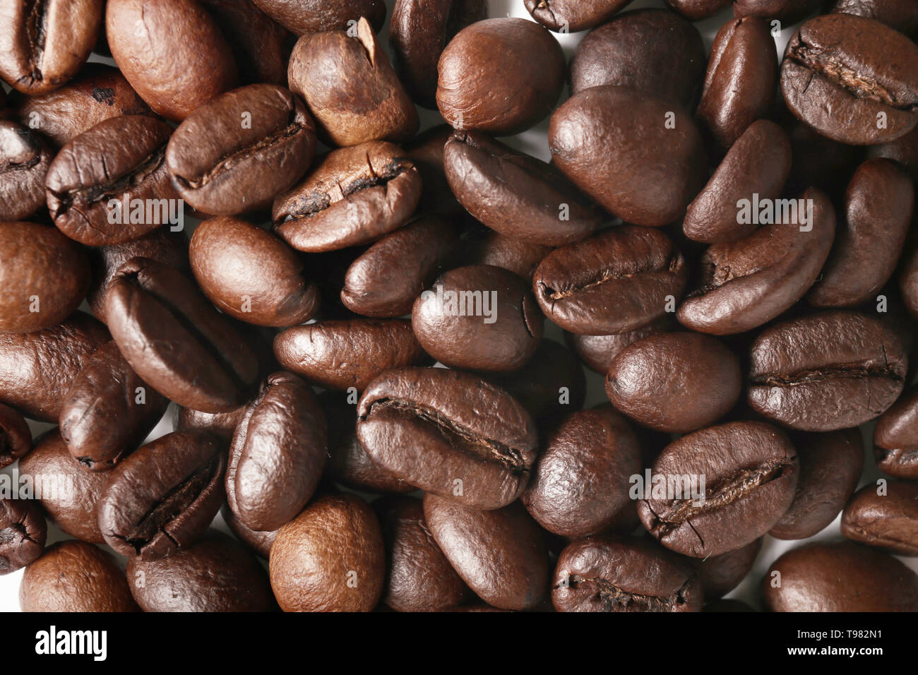 Roasted coffee beans as background Stock Photo - Alamy