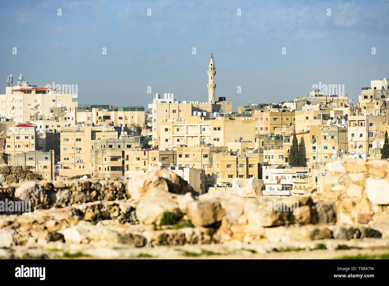 (Selective focus) Stunning view of the Amman skyline seen from the Amman Citadel in Jordan with a mosque in the distance. Stock Photo
